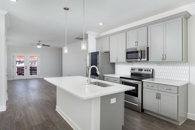 1978 Mitchell Ave Unit 21, Chattanooga, TN 37408 - kitchen with stainless steel appliances, gray cabinets, a ceiling fan, tasteful backsplash, and an island with sink