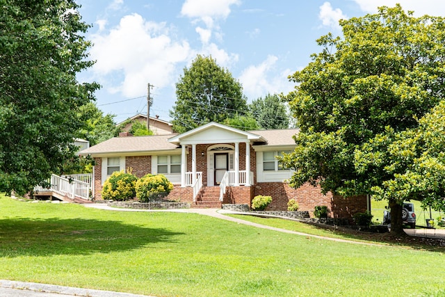 6413 Edgmon Dr, Chattanooga, TN 37421 - view of front of home with brick siding and a front yard
