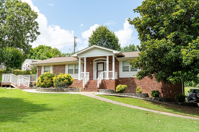 6413 Edgmon Dr, Chattanooga, TN 37421 - ranch-style home featuring brick siding and a front lawn