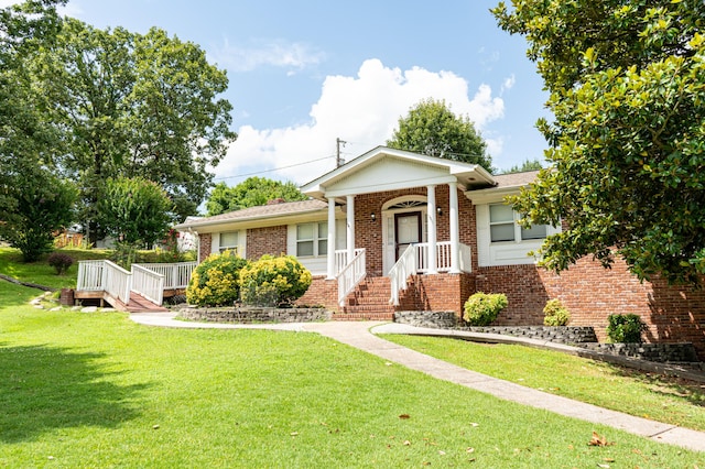 6413 Edgmon Dr, Chattanooga, TN 37421 - ranch-style home featuring brick siding and a front lawn