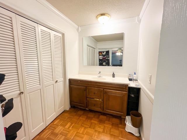 6413 Edgmon Dr, Chattanooga, TN 37421 - bathroom featuring a closet, ornamental molding, vanity, and a textured ceiling