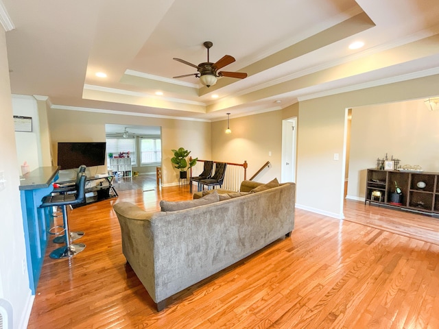 6413 Edgmon Dr, Chattanooga, TN 37421 - living room with a raised ceiling, a ceiling fan, ornamental molding, light wood-style flooring, and recessed lighting