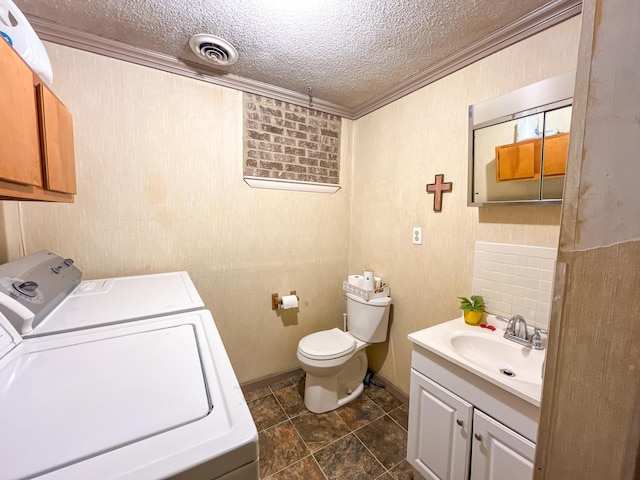 6413 Edgmon Dr, Chattanooga, TN 37421 - bathroom featuring independent washer and dryer, ornamental molding, a textured ceiling, and vanity