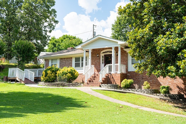 6413 Edgmon Dr, Chattanooga, TN 37421 - view of front of property featuring brick siding, a front lawn, and covered porch