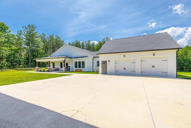 143 Walden Dr, Signal Mountain, TN 37377 - modern inspired farmhouse with driveway, a front yard, an attached garage, and a shingled roof