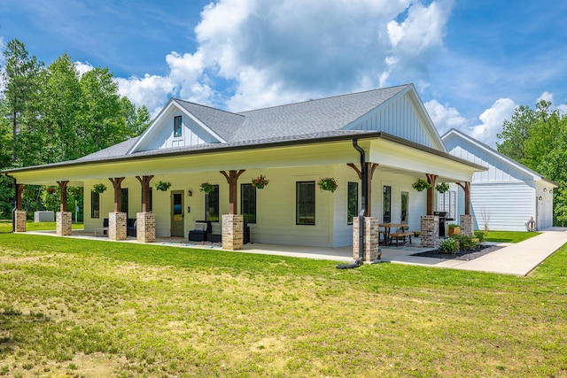 143 Walden Dr, Signal Mountain, TN 37377 - rear view of house with board and batten siding, a yard, a porch, and roof with shingles