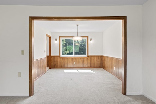 4920 Pine Cir, Ooltewah, TN 37363 - spare room featuring a wainscoted wall, carpet floors, and wood walls