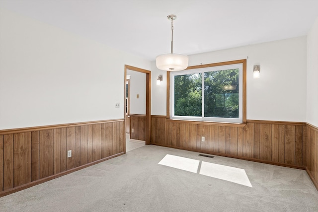 4920 Pine Cir, Ooltewah, TN 37363 - spare room with a wainscoted wall, wooden walls, and carpet flooring