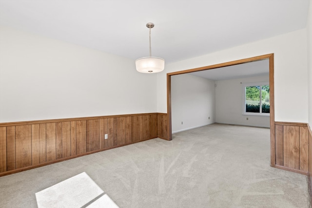 4920 Pine Cir, Ooltewah, TN 37363 - unfurnished room featuring wainscoting, wood walls, and light carpet