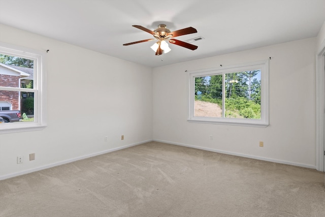 4920 Pine Cir, Ooltewah, TN 37363 - empty room featuring healthy amount of natural light, light colored carpet, and a ceiling fan