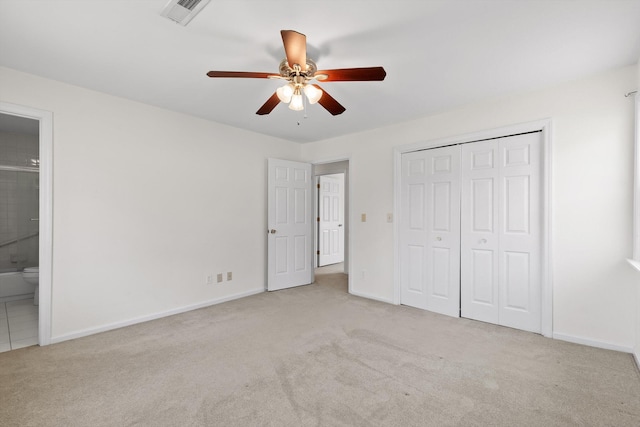 4920 Pine Cir, Ooltewah, TN 37363 - unfurnished bedroom with carpet floors, a closet, ensuite bathroom, and a ceiling fan