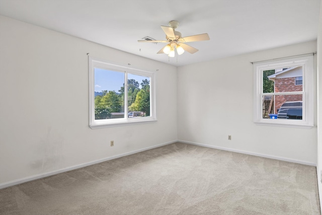 4920 Pine Cir, Ooltewah, TN 37363 - carpeted empty room featuring plenty of natural light and a ceiling fan