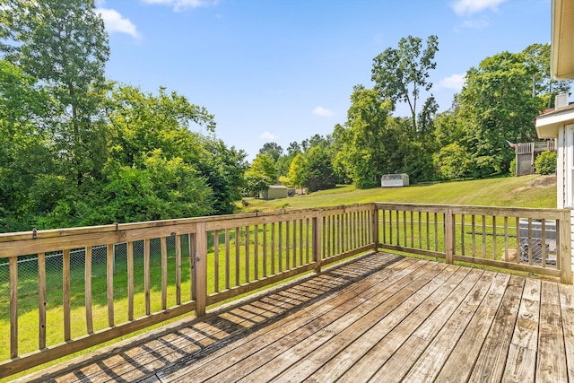 4920 Pine Cir, Ooltewah, TN 37363 - wooden deck featuring a storage unit and a lawn