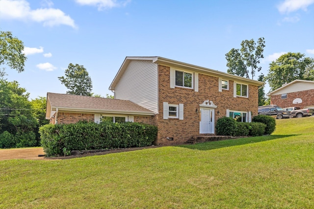 4920 Pine Cir, Ooltewah, TN 37363 - colonial-style house with brick siding and a front yard