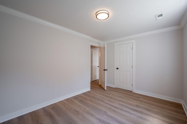 103 Laurel Dr, Chattanooga, TN 37415 - unfurnished room with wood finished floors, crown molding, and a textured ceiling