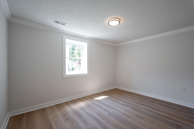 103 Laurel Dr, Chattanooga, TN 37415 - spare room with wood finished floors, a textured ceiling, and ornamental molding