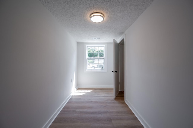 103 Laurel Dr, Chattanooga, TN 37415 - corridor featuring a textured ceiling and wood finished floors