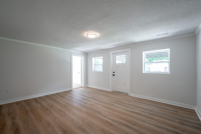 103 Laurel Dr, Chattanooga, TN 37415 - entryway with crown molding, wood finished floors, and a textured ceiling