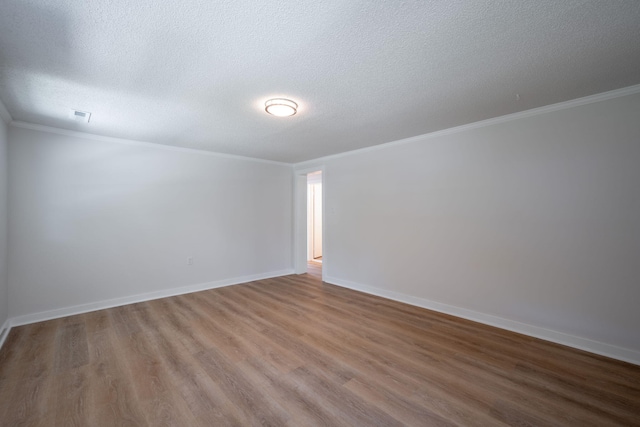 103 Laurel Dr, Chattanooga, TN 37415 - spare room featuring a textured ceiling, wood finished floors, and crown molding