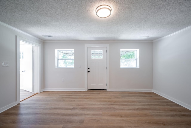 103 Laurel Dr, Chattanooga, TN 37415 - foyer featuring crown molding, light wood finished floors, and a textured ceiling