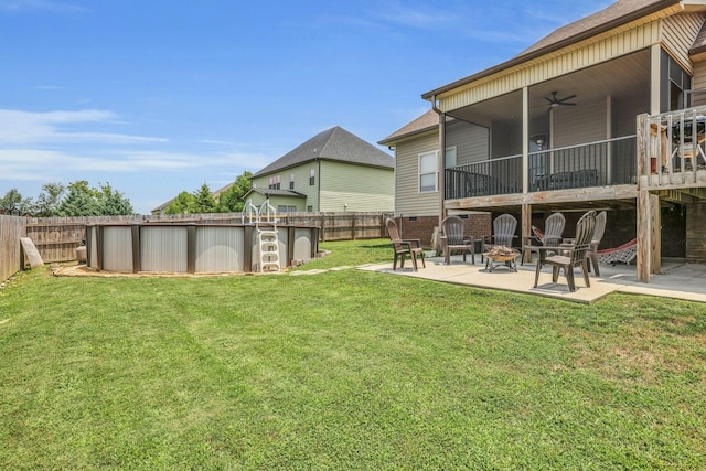 7459 Red Poppy Dr, Ooltewah, TN 37363 - fenced backyard with ceiling fan, a fire pit, a patio, and an outdoor pool