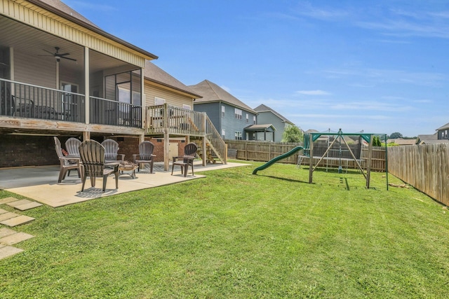 7459 Red Poppy Dr, Ooltewah, TN 37363 - fenced backyard featuring a patio, a playground, stairs, ceiling fan, and a wooden deck