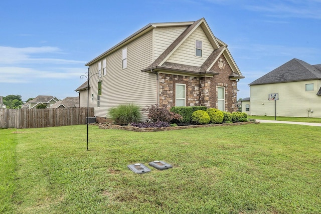 7459 Red Poppy Dr, Ooltewah, TN 37363 - traditional-style home featuring stone siding