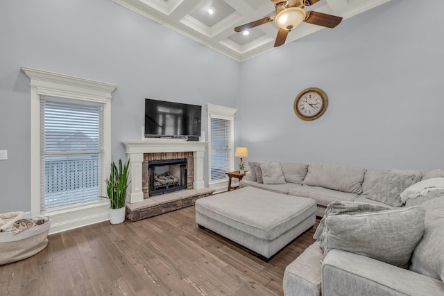7459 Red Poppy Dr, Ooltewah, TN 37363 - living area featuring coffered ceiling, ornamental molding, ceiling fan, a towering ceiling, and beam ceiling