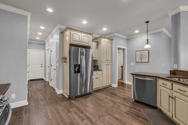 7459 Red Poppy Dr, Ooltewah, TN 37363 - kitchen featuring stainless steel appliances, cream cabinets, crown molding, dark wood-style floors, and recessed lighting