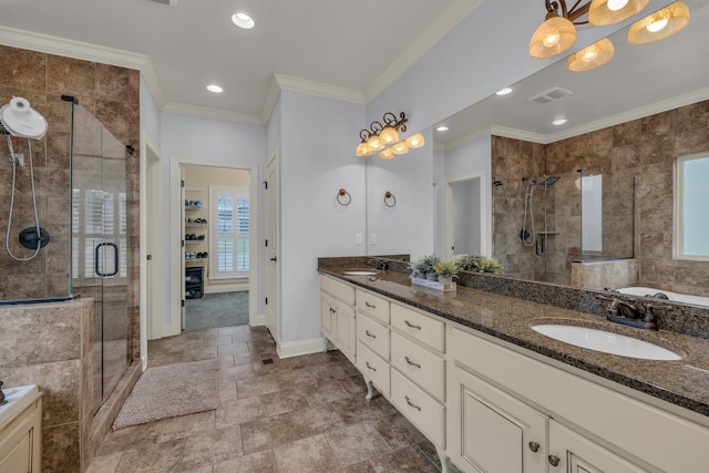 7459 Red Poppy Dr, Ooltewah, TN 37363 - bathroom featuring a stall shower, double vanity, a bath, ornamental molding, and recessed lighting