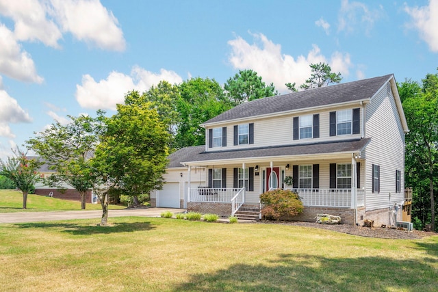 8616 River Cove Dr, Harrison, TN 37341 - colonial home featuring a porch, a garage, driveway, and a front lawn