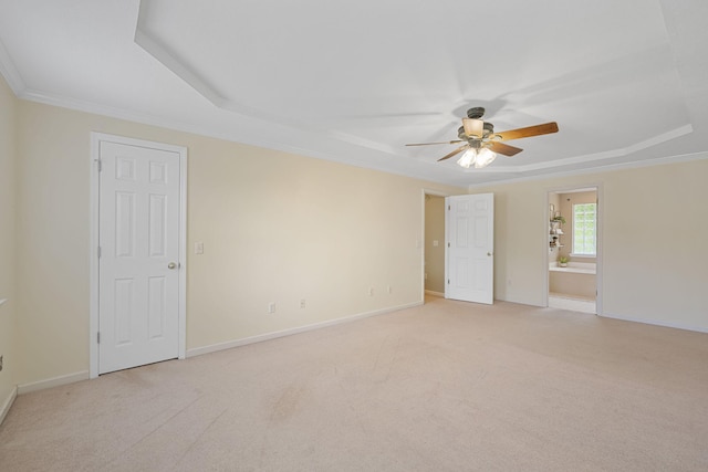 8616 River Cove Dr, Harrison, TN 37341 - unfurnished room featuring a tray ceiling, ceiling fan, light colored carpet, and ornamental molding
