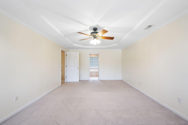 8616 River Cove Dr, Harrison, TN 37341 - spare room featuring a raised ceiling, ceiling fan, light colored carpet, and ornamental molding
