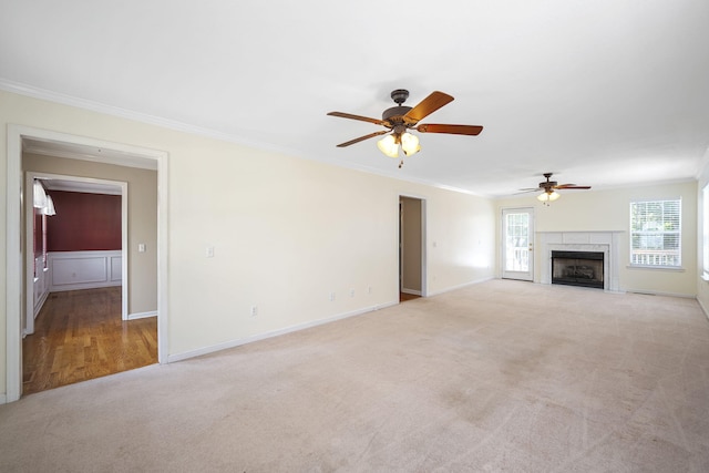 8616 River Cove Dr, Harrison, TN 37341 - unfurnished living room featuring ornamental molding, carpet, ceiling fan, and a fireplace