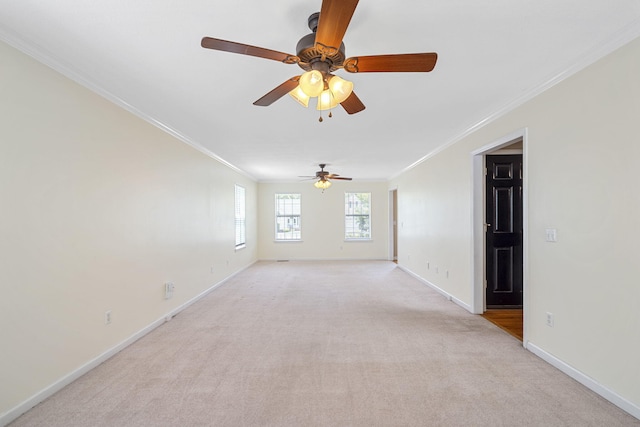 8616 River Cove Dr, Harrison, TN 37341 - spare room featuring crown molding, ceiling fan, and light colored carpet