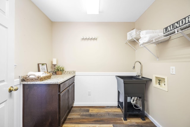 8616 River Cove Dr, Harrison, TN 37341 - washroom featuring washer hookup, dark wood-style floors, cabinet space, and a wainscoted wall