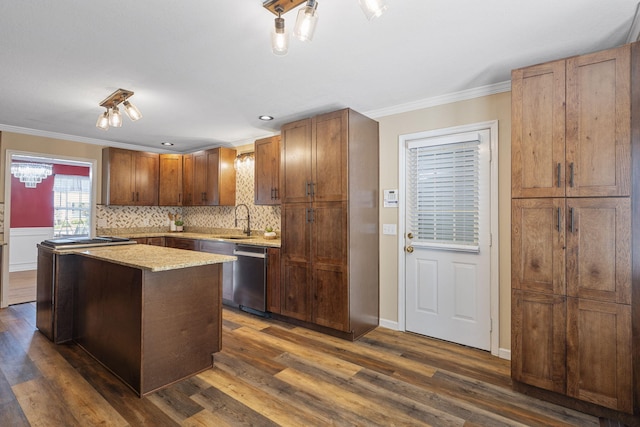 8616 River Cove Dr, Harrison, TN 37341 - kitchen with stainless steel dishwasher, crown molding, dark wood-type flooring, and decorative backsplash