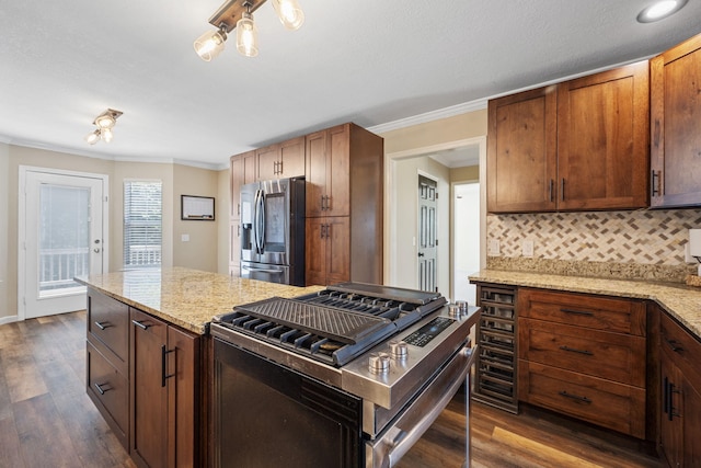 8616 River Cove Dr, Harrison, TN 37341 - kitchen with stainless steel appliances, dark wood-style floors, backsplash, crown molding, and light stone counters