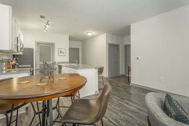 804 Riverfront Pkwy Unit 401, Chattanooga, TN 37402 - dining area with dark wood-type flooring and baseboards