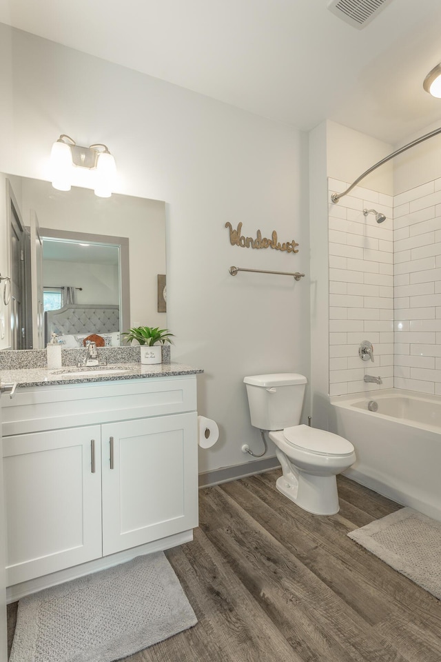 804 Riverfront Pkwy Unit 401, Chattanooga, TN 37402 - full bath with wood finished floors, vanity, and shower / tub combination