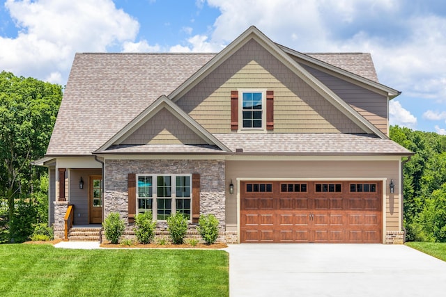 234 Goose Creek Cir, Soddy Daisy, TN 37379 - craftsman house with driveway, a front lawn, roof with shingles, and stone siding
