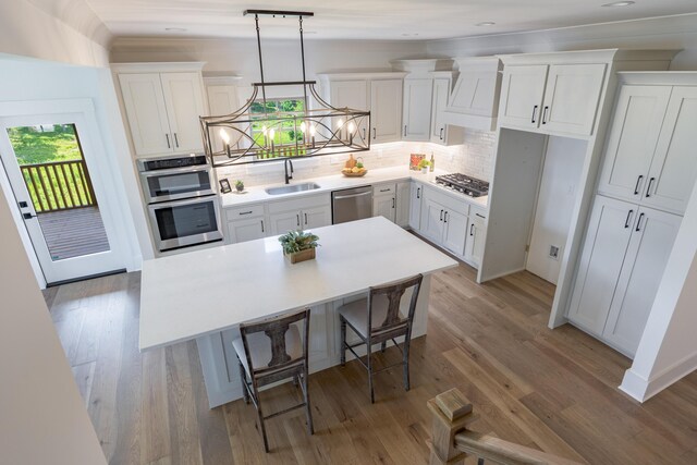 234 Goose Creek Cir, Soddy Daisy, TN 37379 - kitchen with appliances with stainless steel finishes, white cabinetry, and decorative backsplash