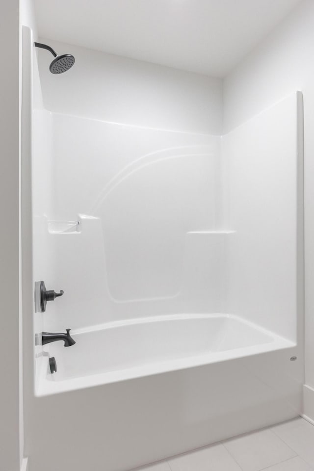 234 Goose Creek Cir, Soddy Daisy, TN 37379 - bathroom with tub / shower combination and tile patterned flooring