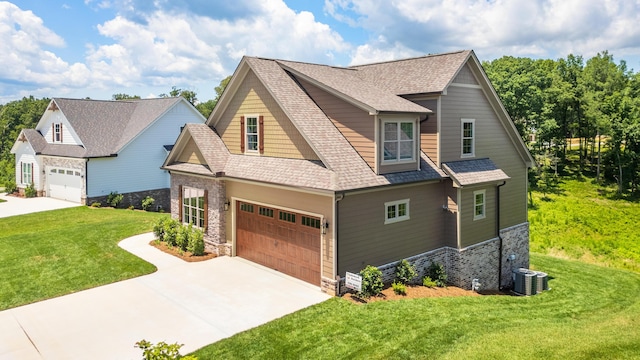 234 Goose Creek Cir, Soddy Daisy, TN 37379 - craftsman inspired home with driveway, stone siding, a front lawn, and a shingled roof