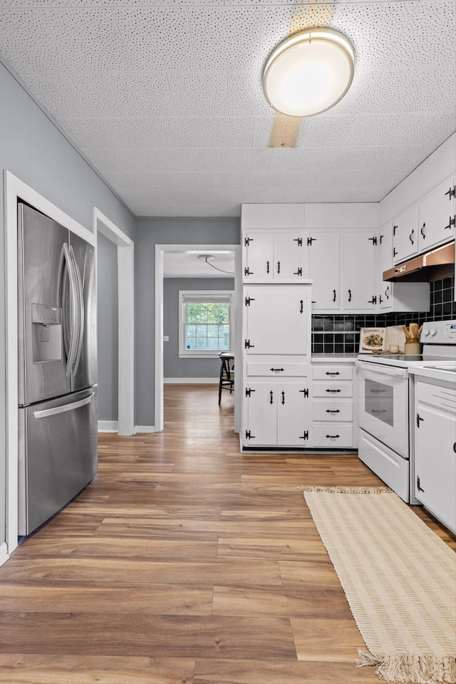 620 Lullwater Rd, Chattanooga, TN 37405 - kitchen featuring stainless steel fridge with ice dispenser, white electric range, under cabinet range hood, white cabinetry, and light wood-type flooring