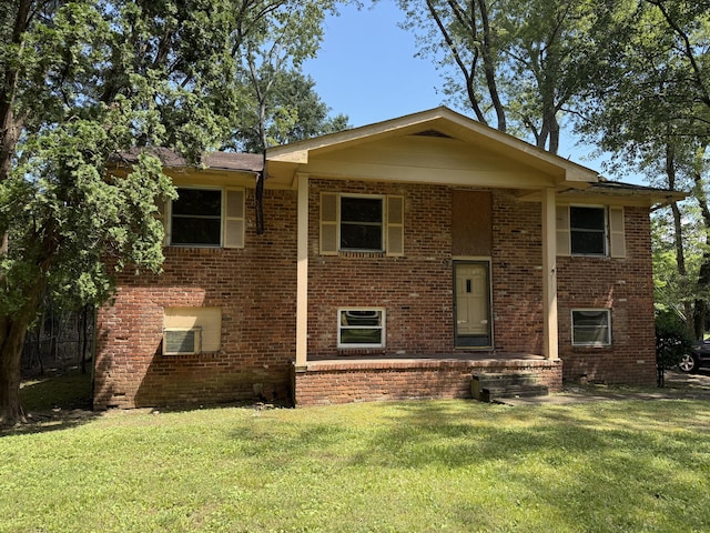 7014 S Dent Rd, Hixson, TN 37343 - bi-level home featuring a front lawn and brick siding