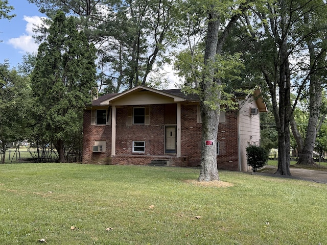 7014 S Dent Rd, Hixson, TN 37343 - raised ranch with brick siding, a front lawn, and cooling unit