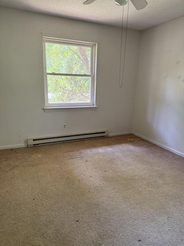 7014 S Dent Rd, Hixson, TN 37343 - unfurnished room featuring a baseboard radiator, carpet, and a ceiling fan