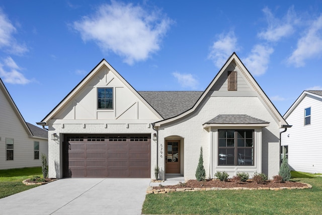 45 Little Sorrel Rd Unit 45, Hixson, TN 37343 - view of front of home featuring brick siding, concrete driveway, a front lawn, a shingled roof, and a garage