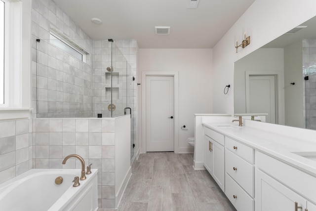 45 Little Sorrel Rd Unit 45, Hixson, TN 37343 - bathroom with a stall shower, a bath, double vanity, and wood finished floors